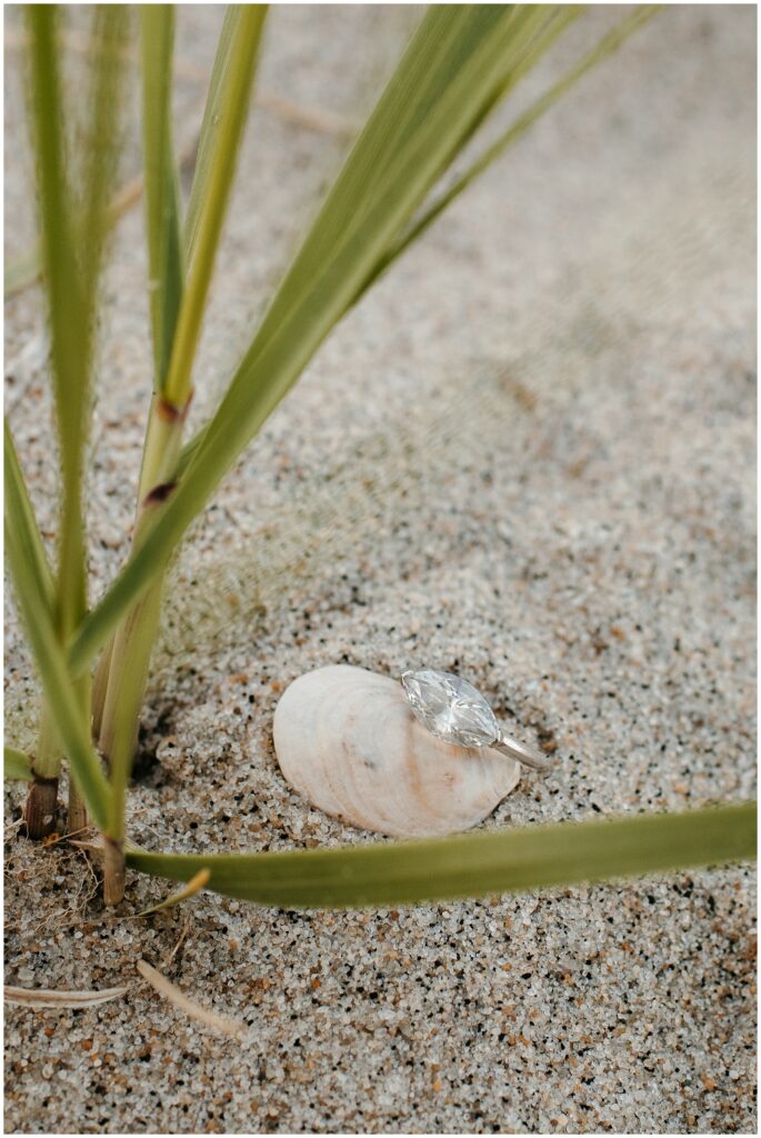 Marquise Diamond Engagement Ring Photo in the Sand by Sydney Madison Creative