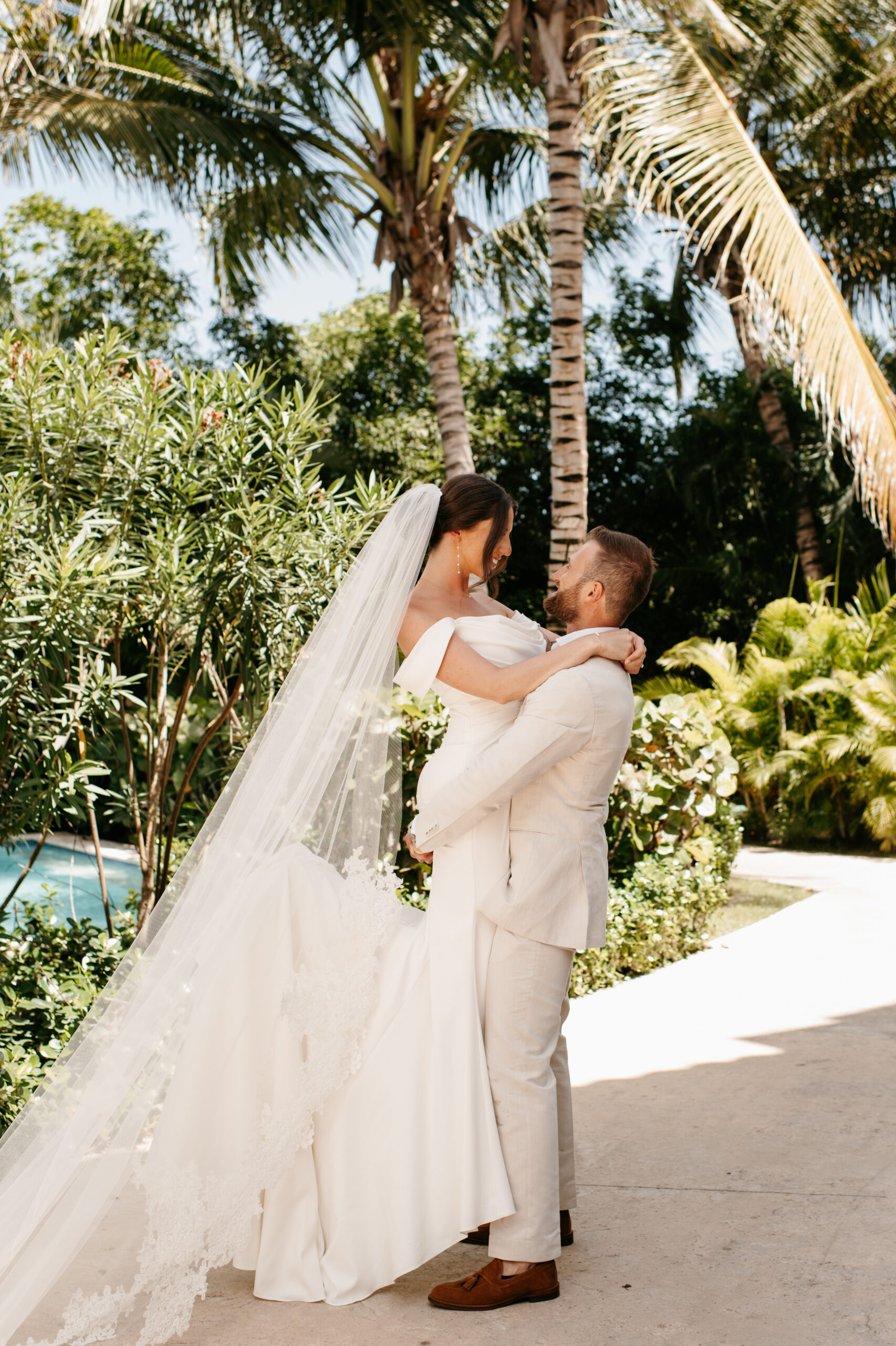 Wedding Couple photos in palm tree walkway in Punta Cana by Sydney Madison Creative